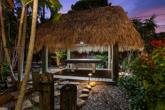 patio terrace at dusk featuring a deck