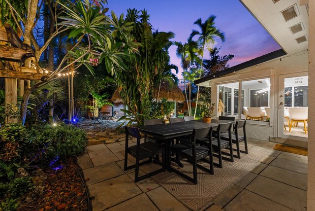 view of patio terrace at dusk