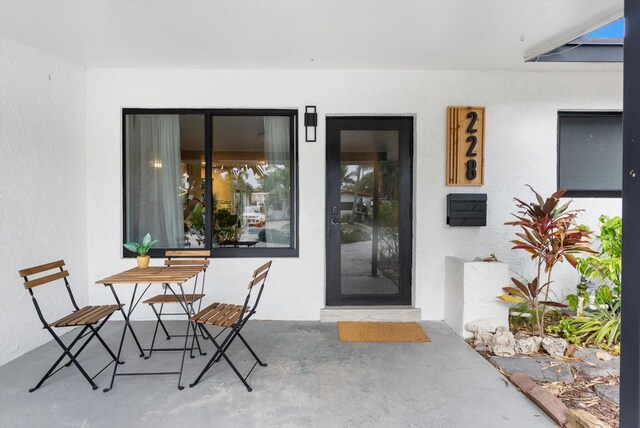 property entrance with a patio