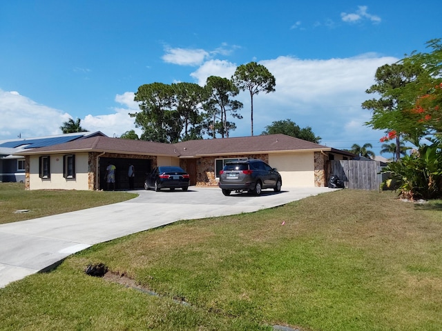 view of front of home featuring a garage and a front yard