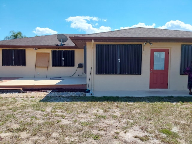 view of front of property with a wooden deck