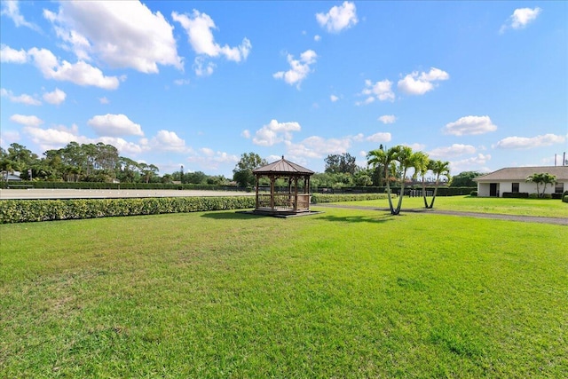 view of property's community featuring a gazebo and a lawn