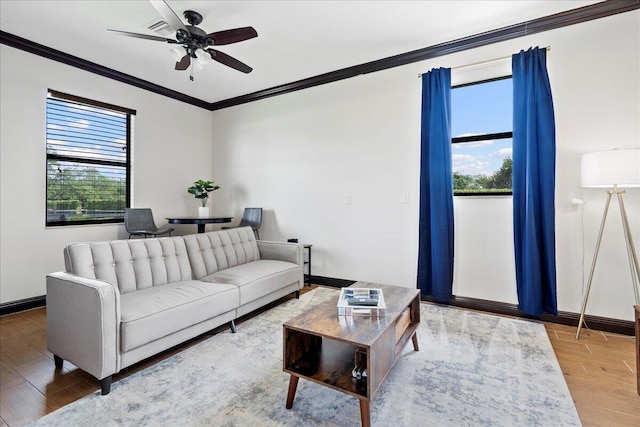 living room with ceiling fan and crown molding