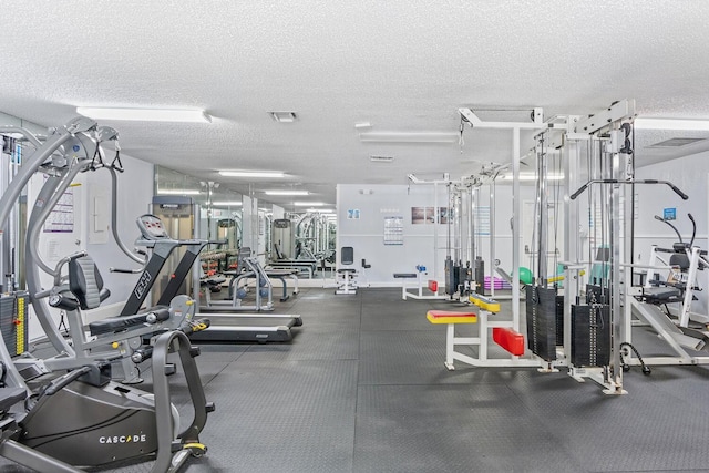 gym with a textured ceiling