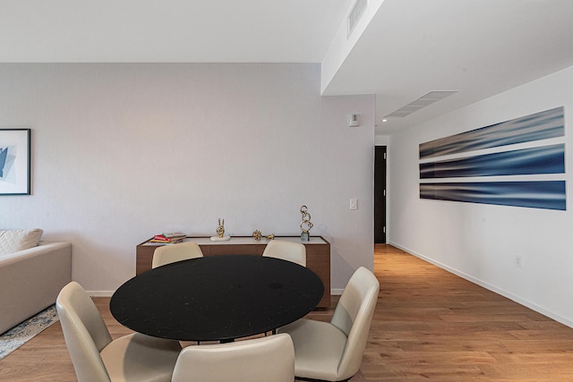 dining room featuring wood-type flooring