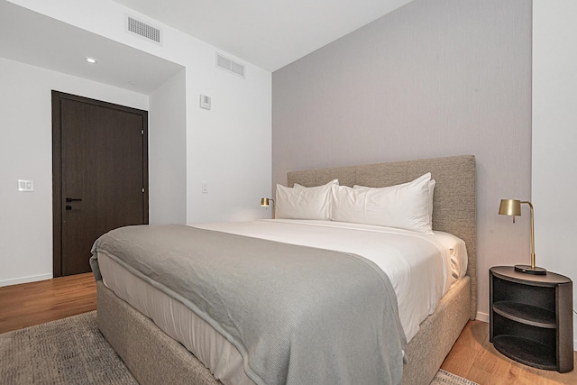 bedroom featuring hardwood / wood-style floors