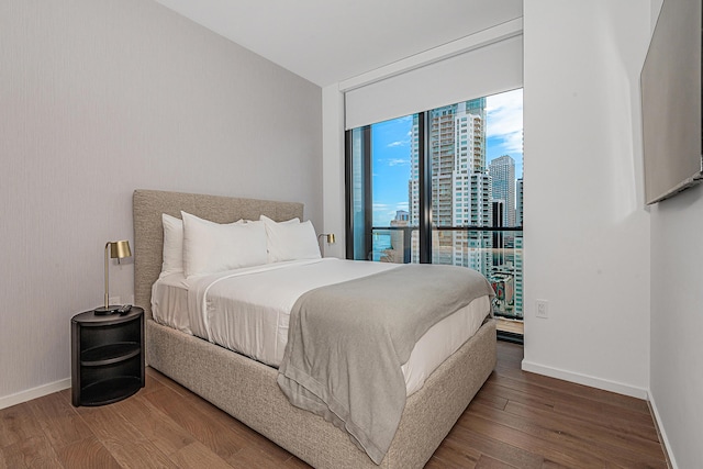 bedroom with hardwood / wood-style flooring