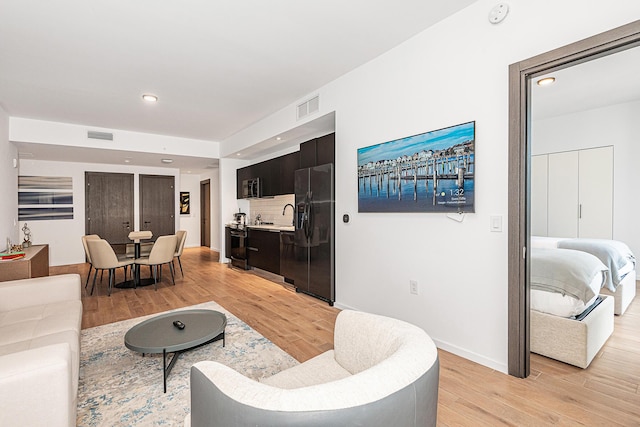 living room with light hardwood / wood-style floors