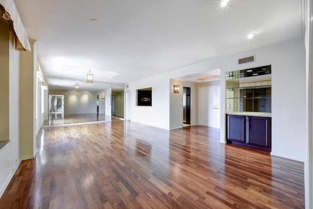 unfurnished living room with wood-type flooring