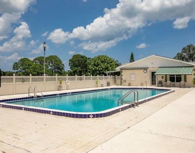 view of pool featuring a patio