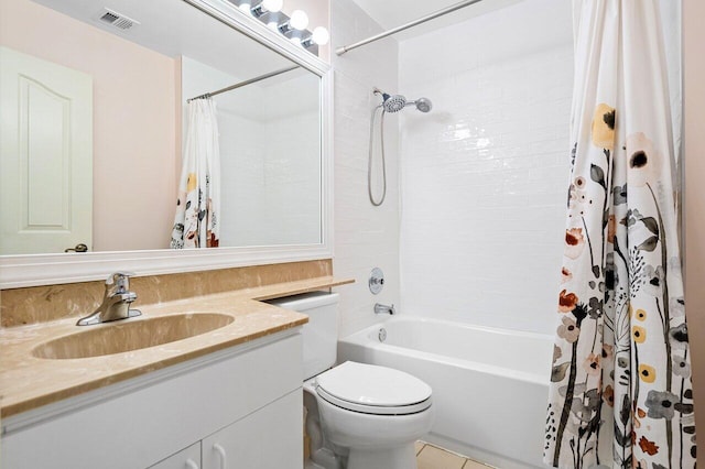 full bathroom with tile patterned floors, vanity, shower / bath combo, and toilet