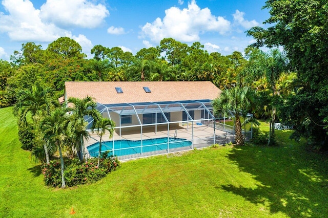 back of property with a yard and a lanai