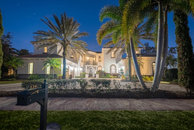 mediterranean / spanish-style house featuring a balcony