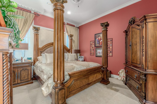 carpeted bedroom featuring ornate columns and ornamental molding