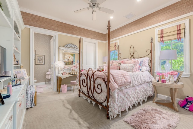 carpeted bedroom with ceiling fan, ornamental molding, and a closet