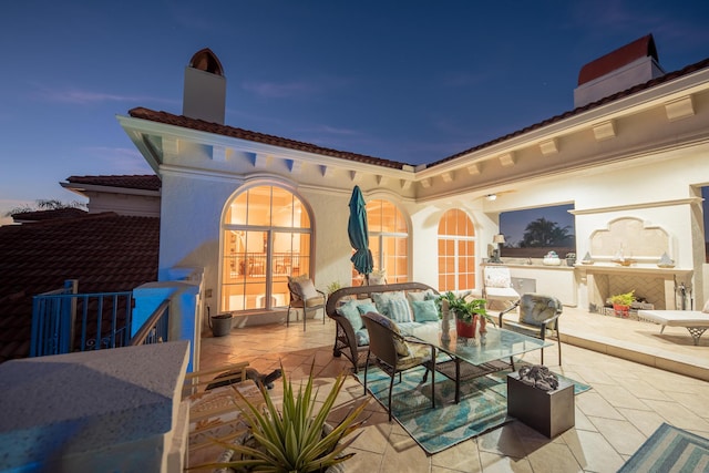 view of patio terrace at dusk