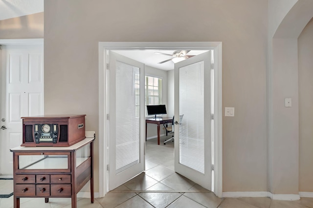 hallway featuring light tile floors