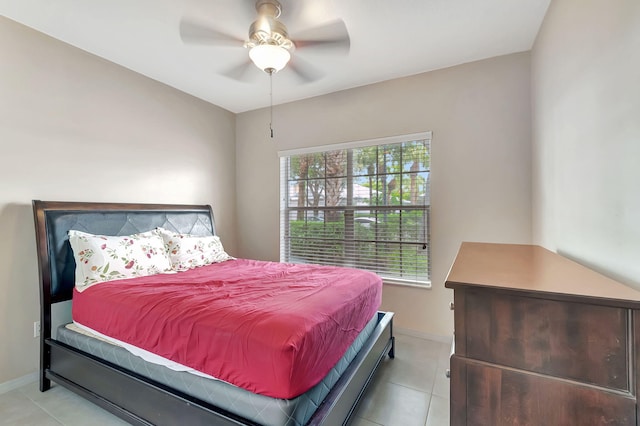 tiled bedroom with ceiling fan