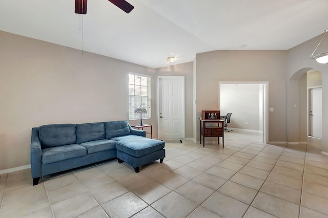 tiled living room with ceiling fan and lofted ceiling