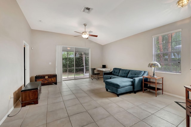 tiled living room with ceiling fan and lofted ceiling