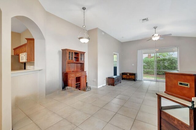 interior space featuring vaulted ceiling and ceiling fan