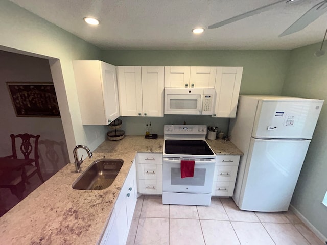 kitchen featuring white cabinets, ceiling fan, sink, and white appliances