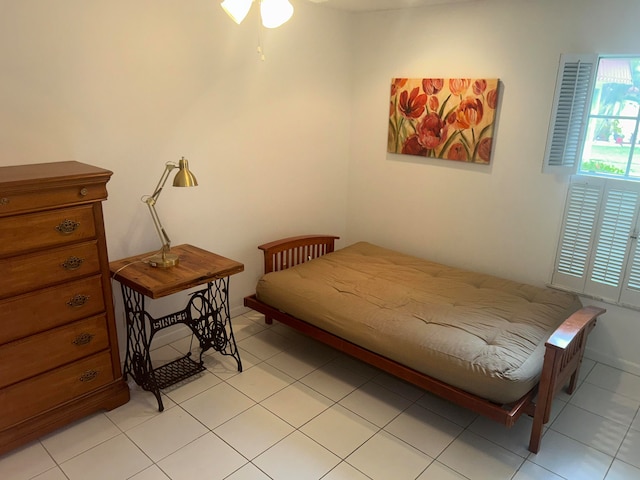 bedroom with light tile floors