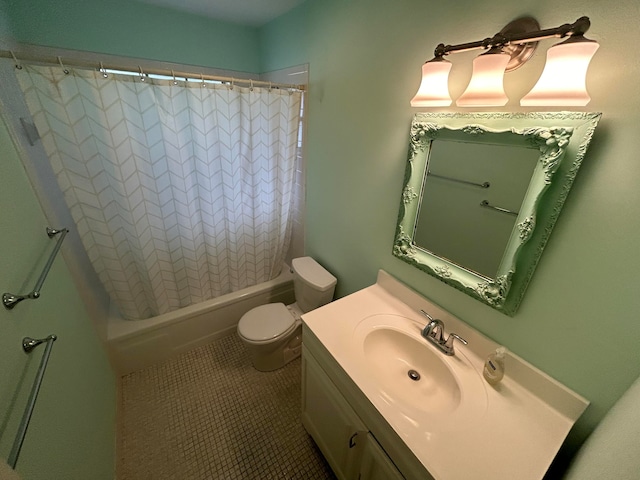 full bathroom featuring tile floors, vanity with extensive cabinet space, toilet, and shower / tub combo