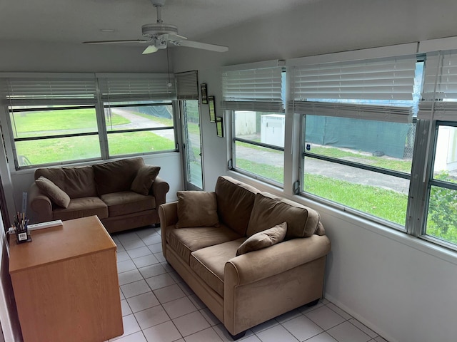 sunroom featuring ceiling fan