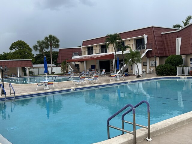 view of swimming pool featuring a patio area