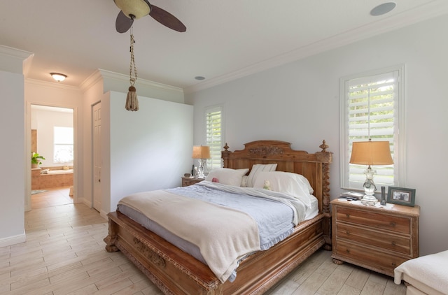 bedroom with ceiling fan, multiple windows, connected bathroom, and ornamental molding