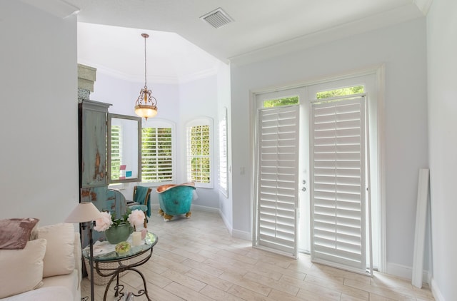 living room featuring light hardwood / wood-style flooring and ornamental molding