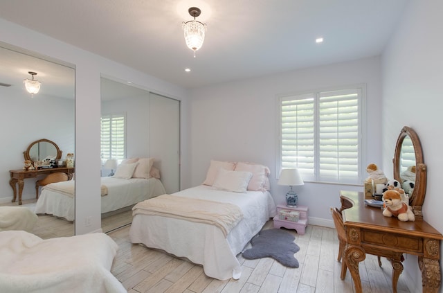 bedroom with light hardwood / wood-style floors