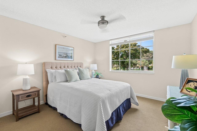 127 Yacht Club Way Unit 206, Hypoluxo, FL 33462 - bedroom featuring light colored carpet, a textured ceiling, and baseboards