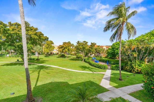 127 Yacht Club Way Unit 206, Hypoluxo, FL 33462 - surrounding community with a lawn