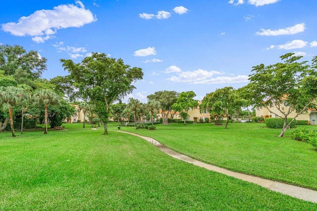 127 Yacht Club Way Unit 206, Hypoluxo, FL 33462 - view of property's community with a lawn