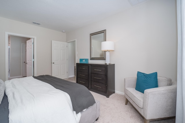 bedroom with light colored carpet