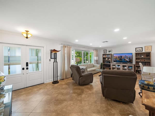 living room featuring french doors and ornamental molding