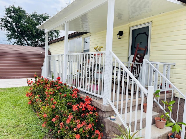 doorway to property with covered porch