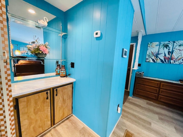 bathroom with wood-type flooring