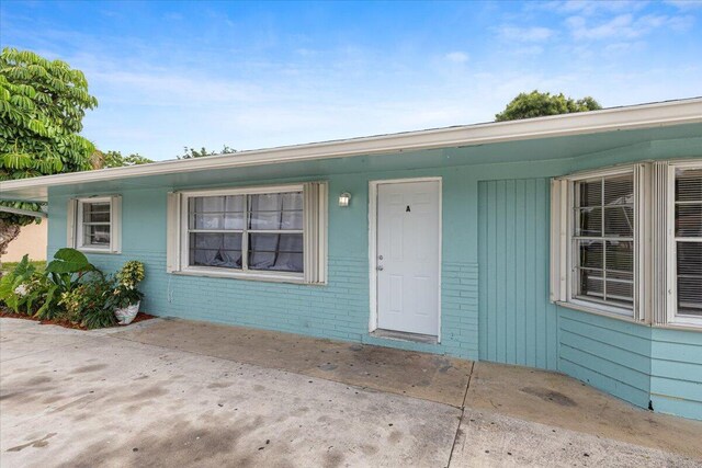 doorway to property featuring a patio