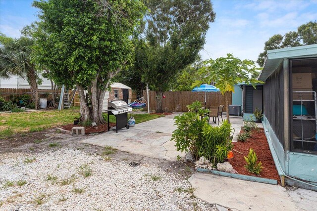 view of patio with an outbuilding and grilling area