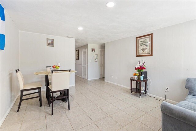 living room with light tile patterned floors and a textured ceiling