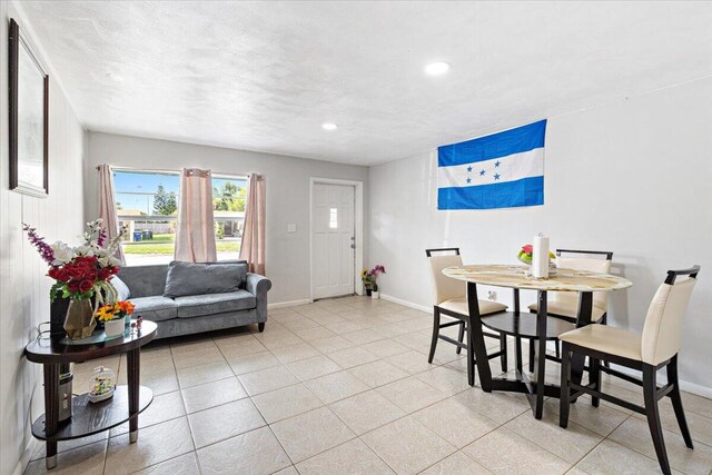 kitchen featuring backsplash, sink, white cabinets, and white appliances