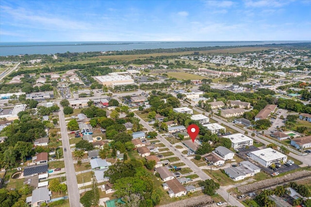 bird's eye view with a water view