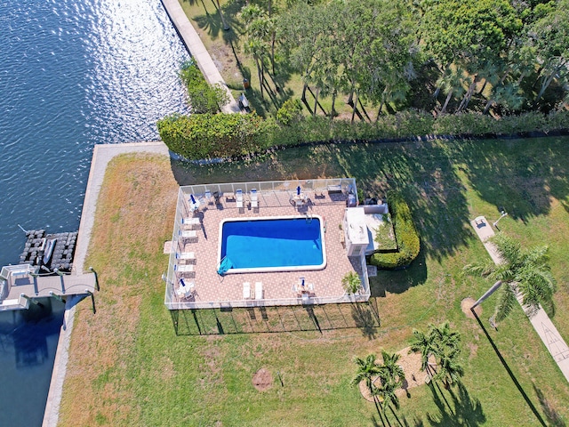 view of swimming pool featuring a water view