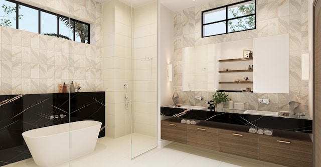 bathroom featuring vanity, tile walls, and shower with separate bathtub