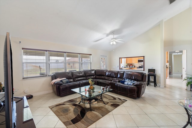 tiled living room featuring high vaulted ceiling and ceiling fan