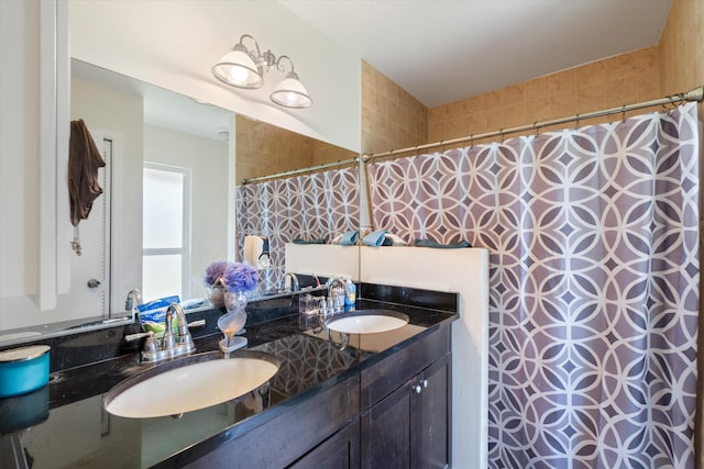 bathroom with dual sinks and oversized vanity