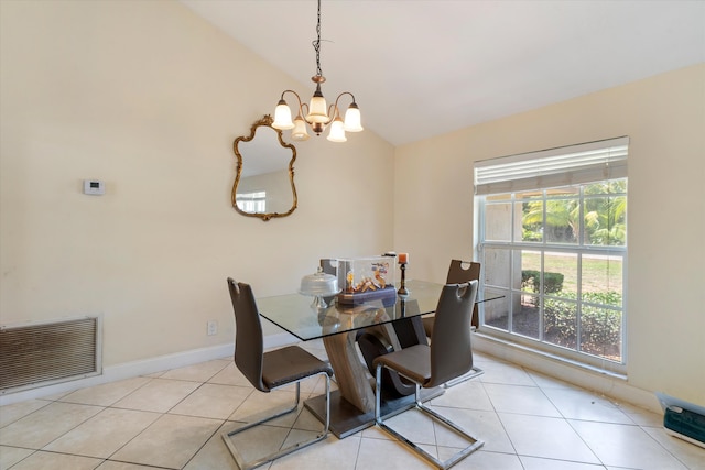 tiled dining room featuring a notable chandelier, a wealth of natural light, and vaulted ceiling